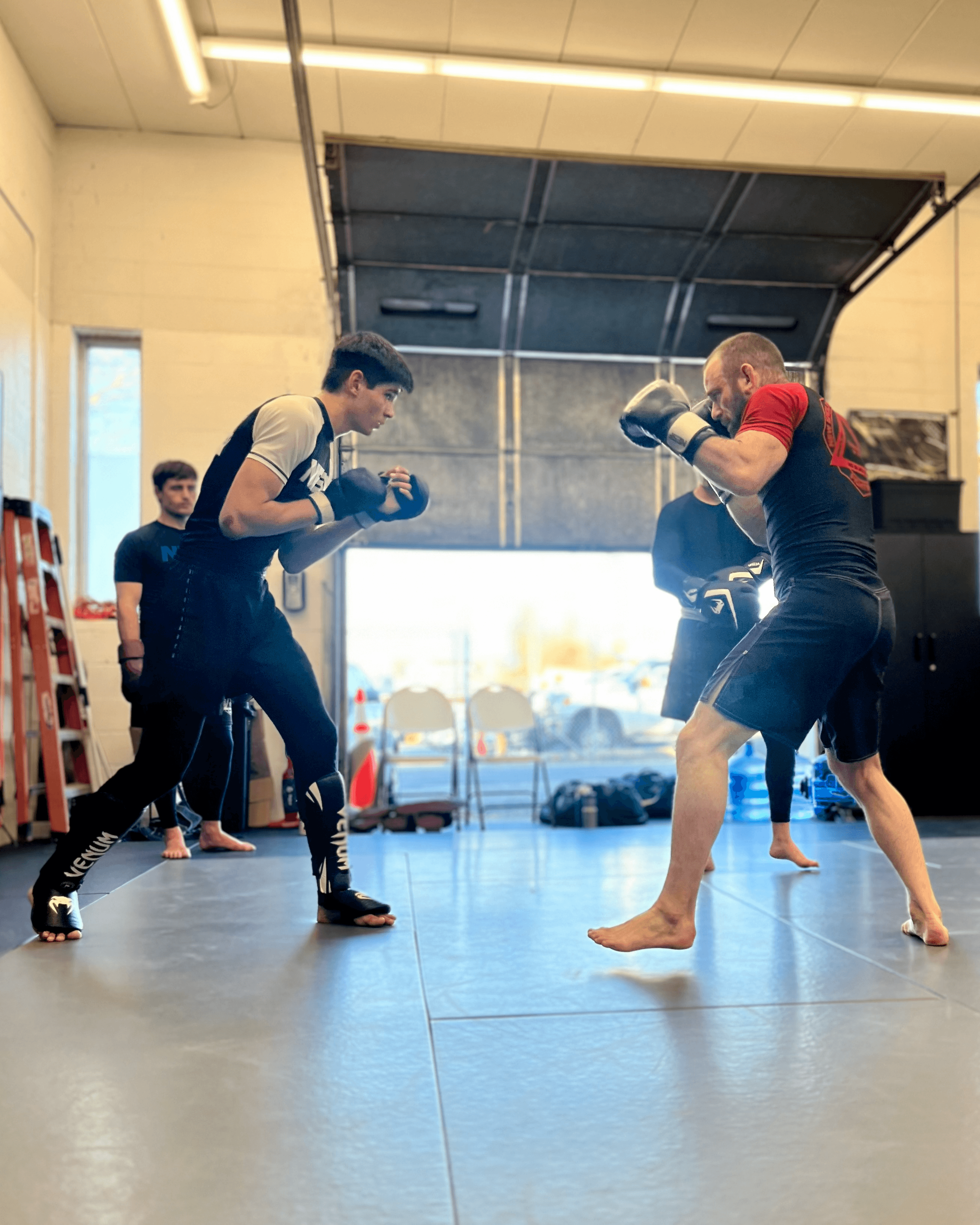 Head instructor sparring with a student.