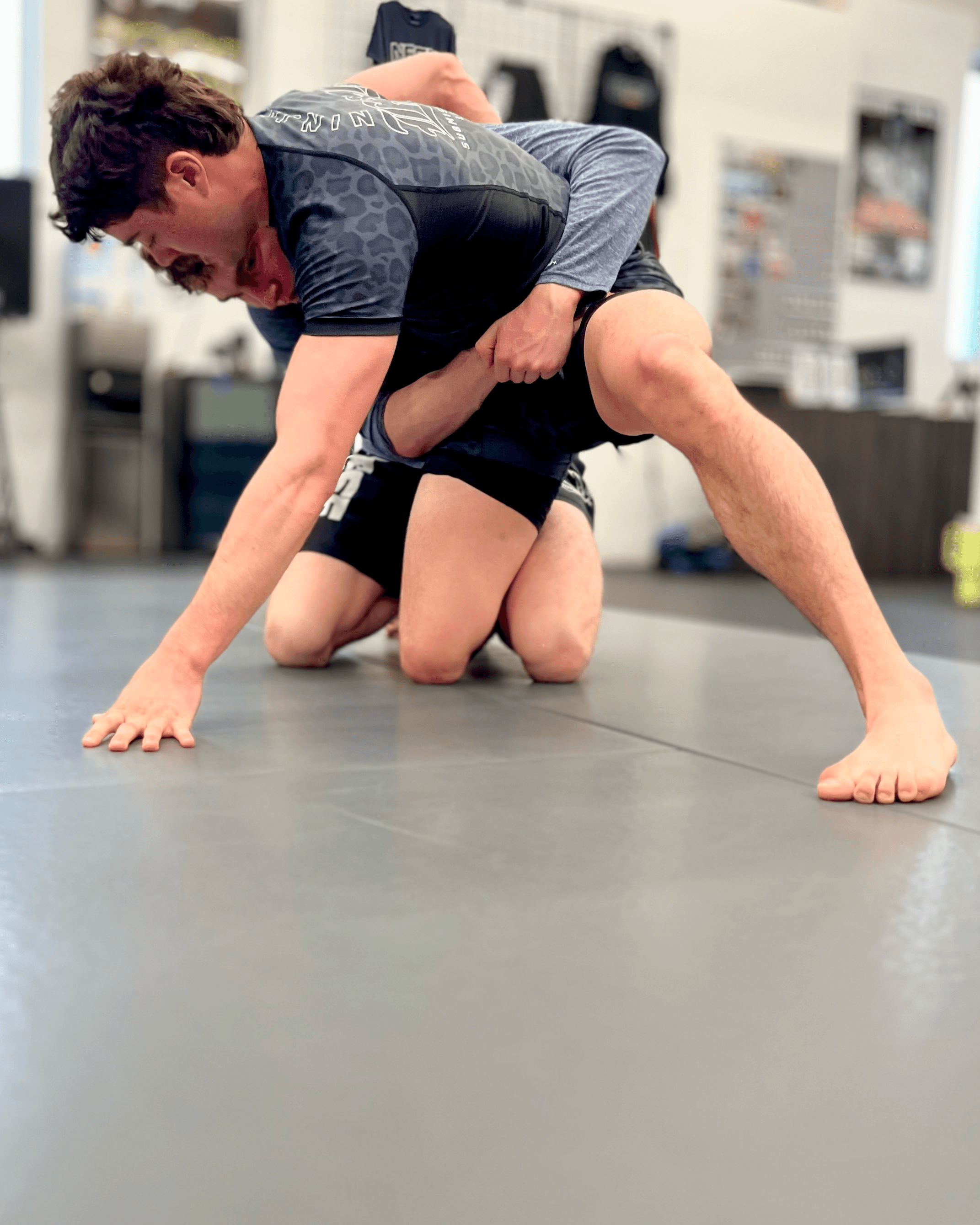 Students scrambling in Jiu-Jitsu.