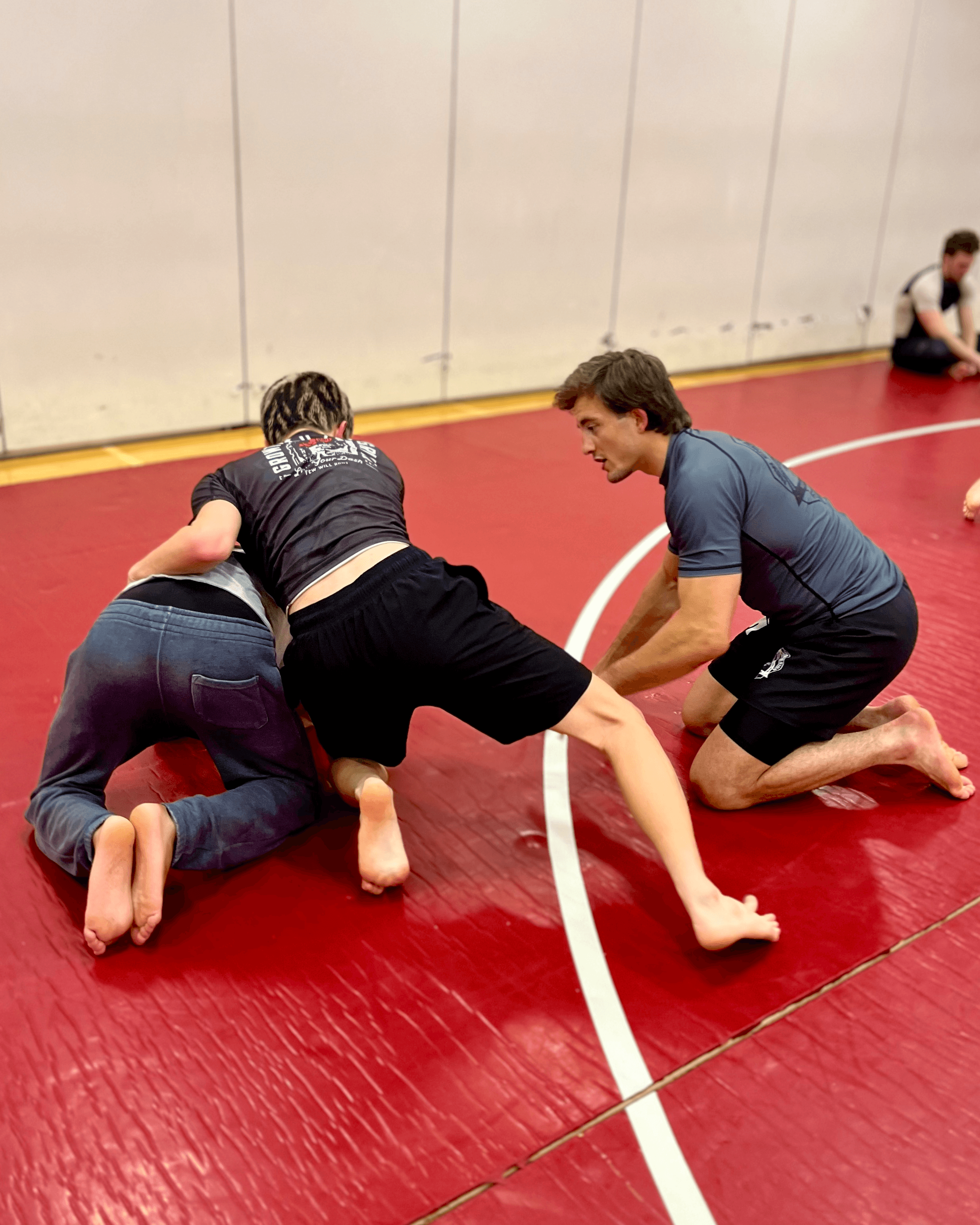 Assistant instructor giving individual feedback.